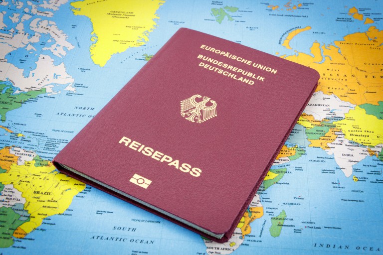 German Passport on a world map How to Get German Citizenship